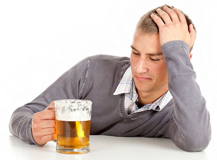 A man drinks beer as to leave